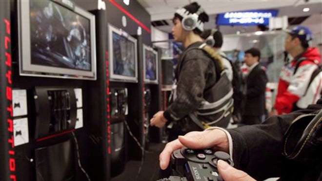 People playing Sony PlayStation
